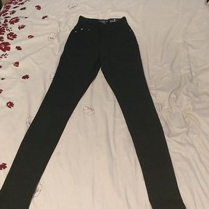 Black skinny-leg, high waisted jeans